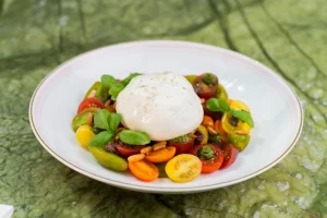 Creamy Burrata with tomatoes and basil pesto